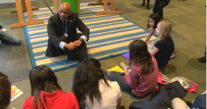 Denver Mayor Michael Hancock speaks with local students at the Denver Art Museum.  